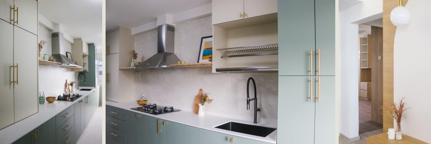 Sage-green kitchen cabinets with brass handles